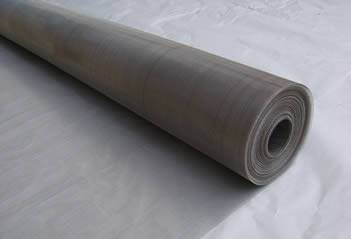 A roll of 304Q stainless steel wire mesh on a piece of paper
