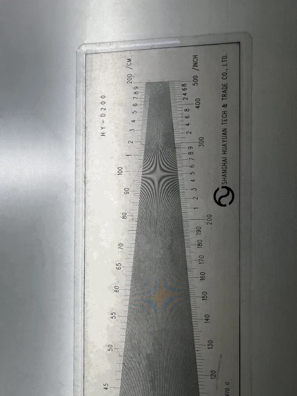 Measure the mesh count of 304 stainless steel woven mesh with a density gauge.