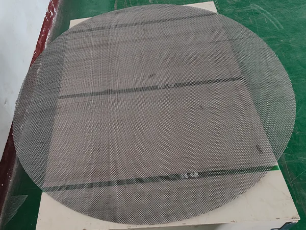 321 stainless steel wire mesh discs placed on a tabletop.