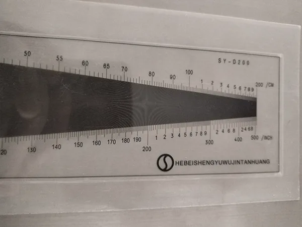 Measure the mesh count of 904L stainless steel wire mesh with a density gauge.