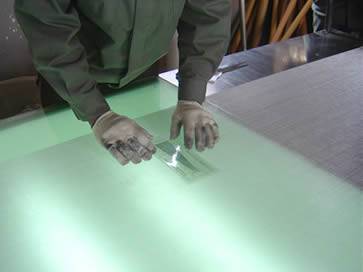 A man is testing a stainless steel mesh