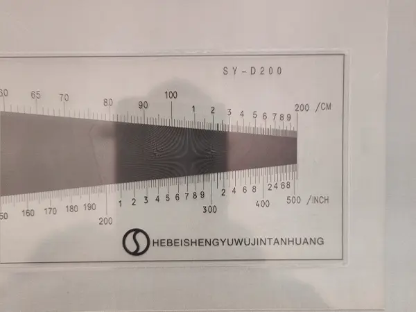 Measure the mesh count of tensile bolting cloth with a density gauge.