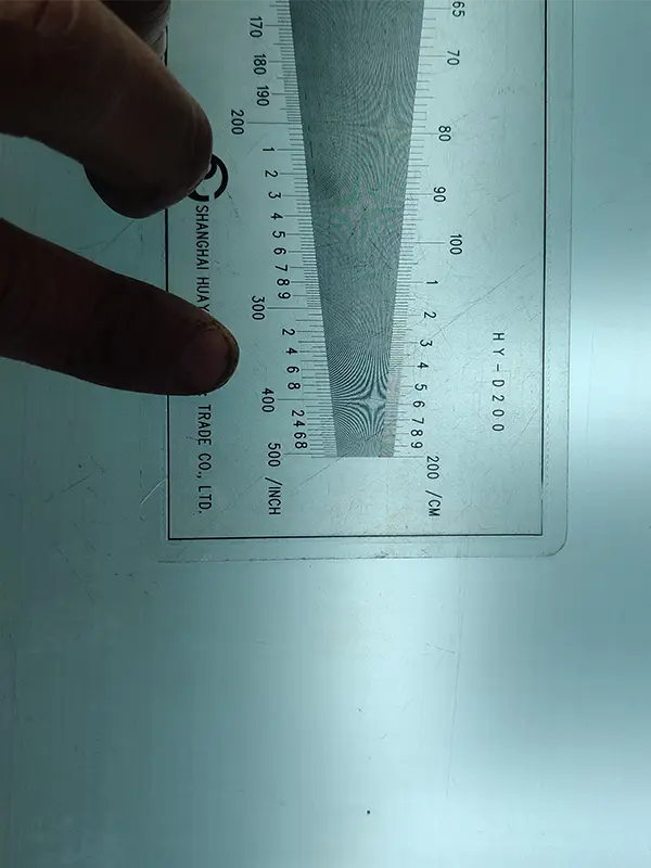 The mesh count of twill weave metal mesh is measured with a density gauge.